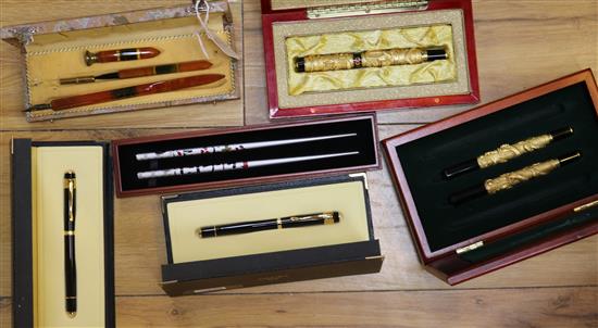 A collection of fountain pens and writing equipment